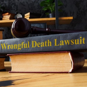 A gavel resting on a "Wrongful Death Lawsuit" book, symbolizing legal action and justice in wrongful death cases